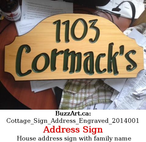 House address sign with family name
